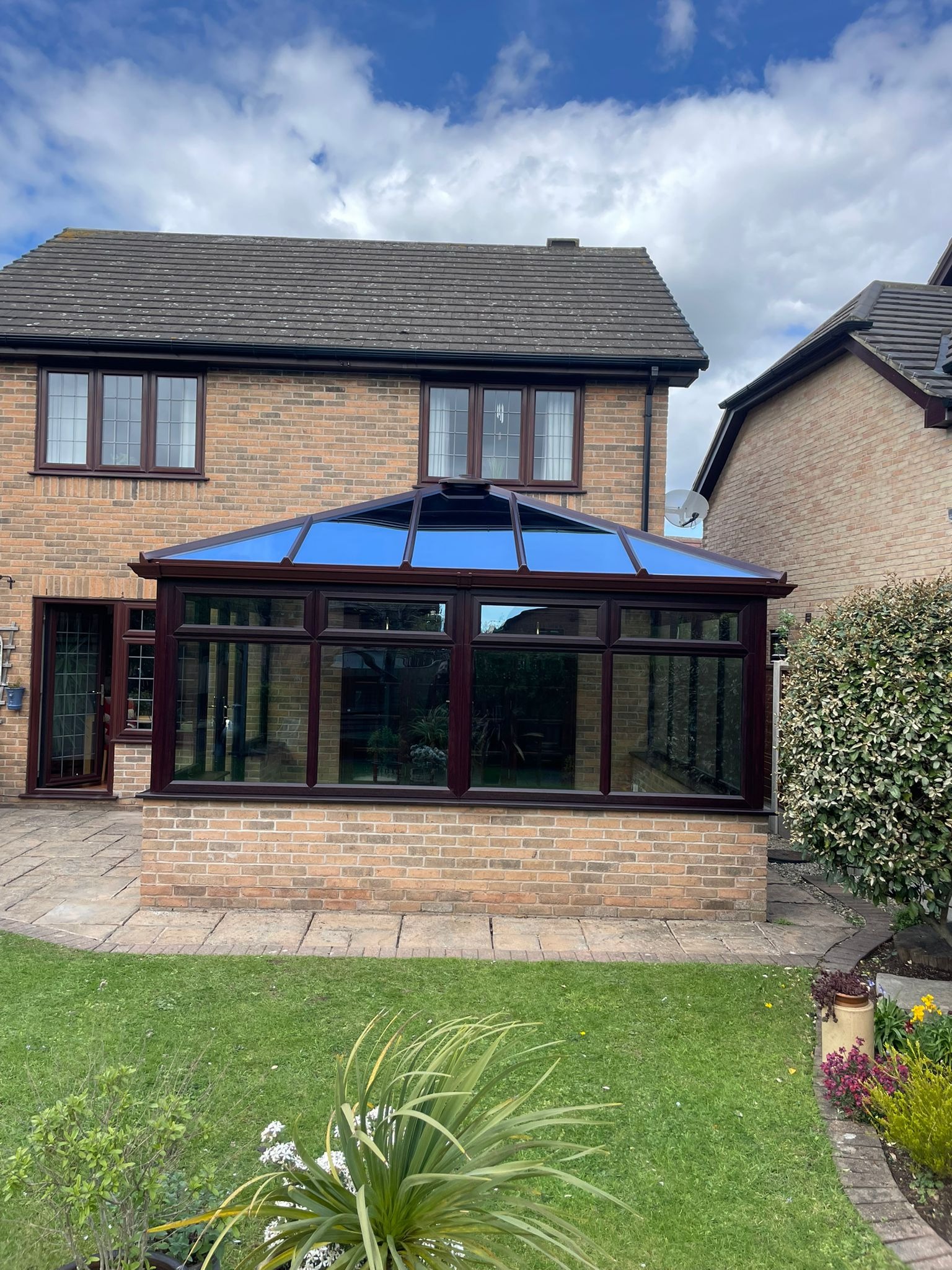 Stylish conservatory extension enhancing a modern family home with additional living space.