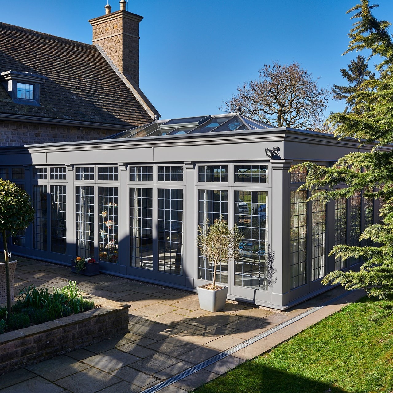 Traditional lantern roof conservatories bringing natural light into a stylish residential home.